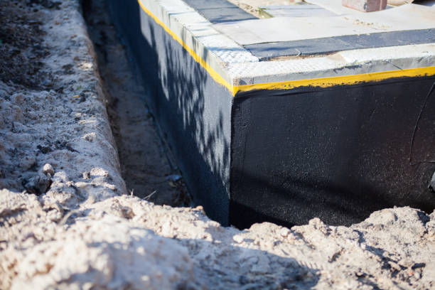 Professional Waterproofing technician working in Randolph, AL